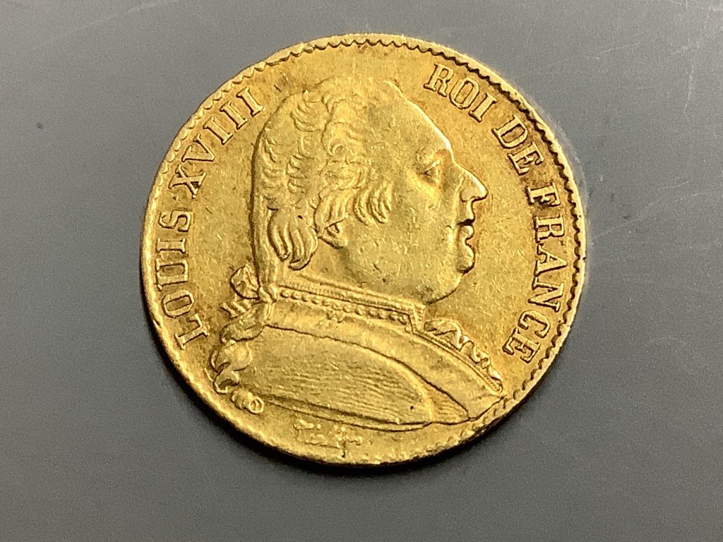 A French 20 Franc gold coin, 1814, Louis XVIII bare head to obverse, crowned wreath to reverse